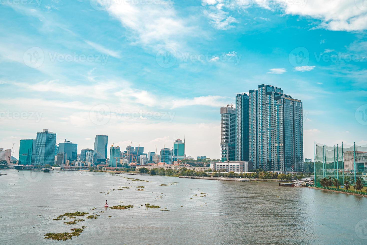 Ho Chi Minh City, VIETNAM - FEB 12 2022 Bitexco Financial Tower, skyscraper viewed from below toward a sky. Urban development with modern architecture photo