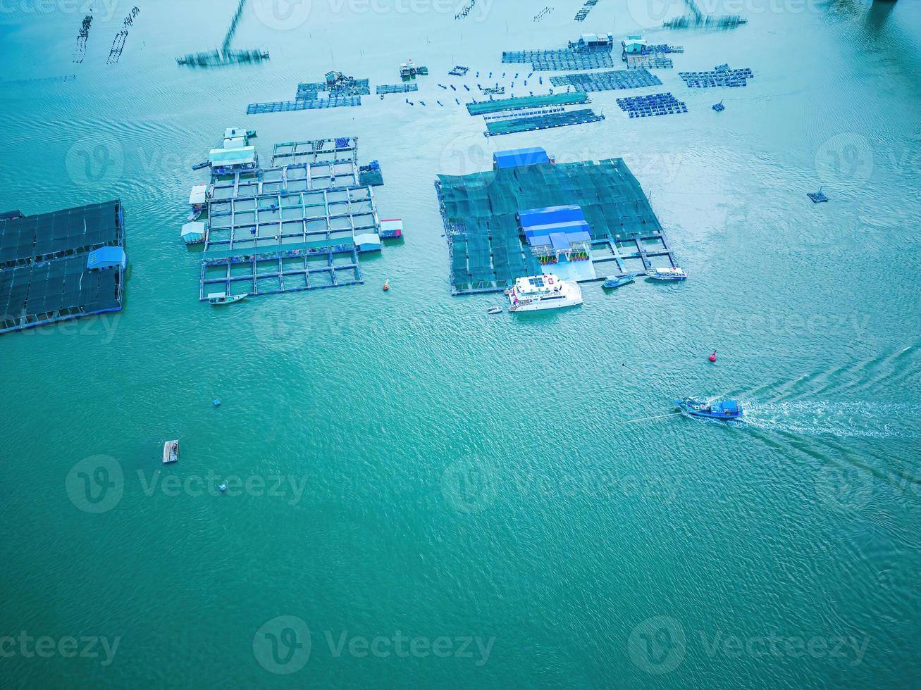 A corner of the oyster feeding farm, float fishing village in Long Son commune, Ba Ria Vung Tau province Vietnam. People living and doing feed fish industry at floating village. photo