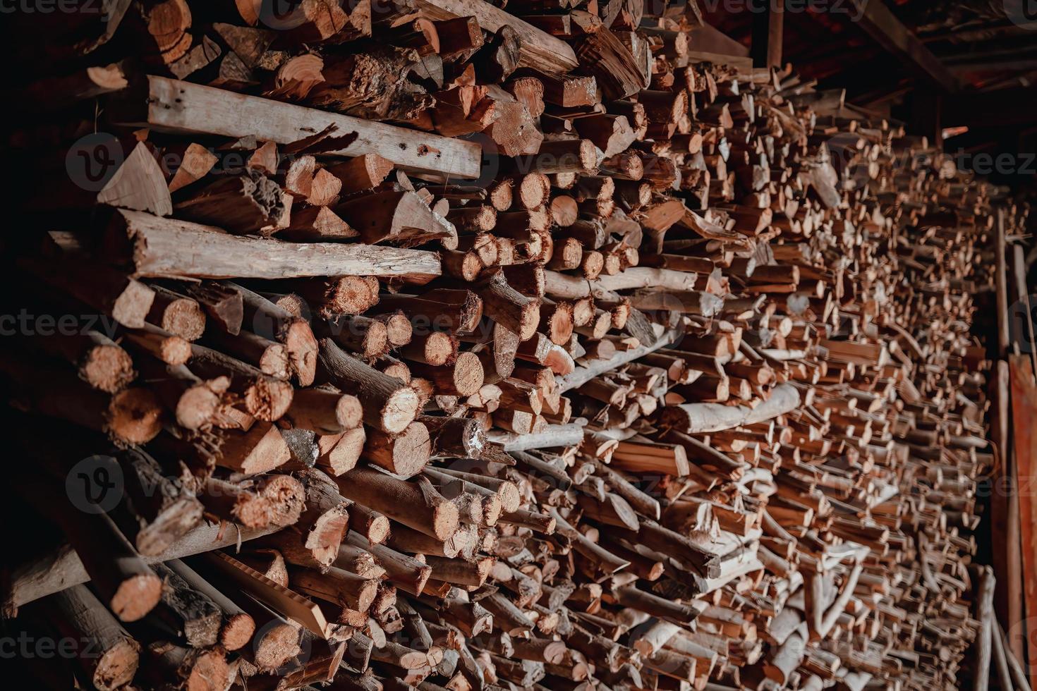 Woodpile fresh cut pine logs at sawmill factory. Big stack of tree trunks at wood production lumber mill. Processing timber material at wood construction warehouse. Chopped firewood stumps. Forestry photo