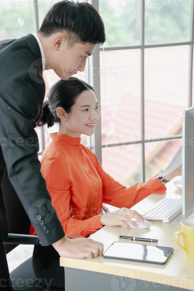 Two people who make meaningful discussions while looking at the graph photo