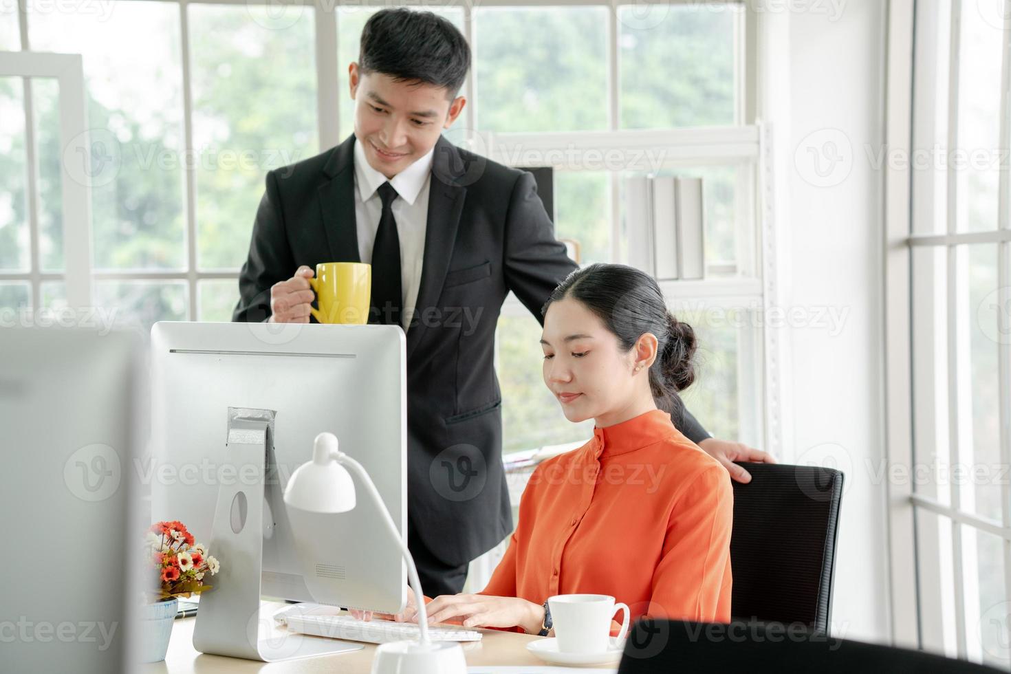 Business people in the office working together. photo