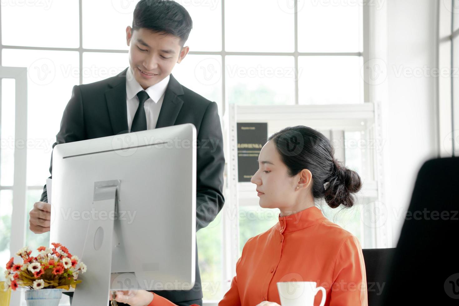 Diverse employees talk cooperating at office table photo