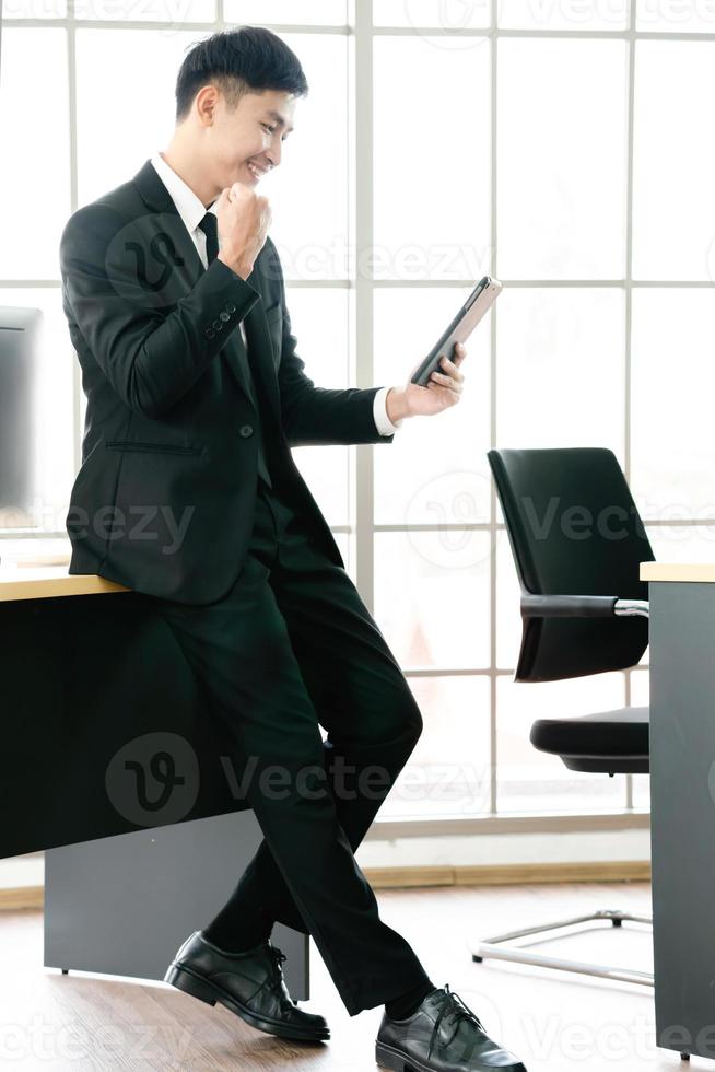 Young Adult using a Tablet in the Office stock photo