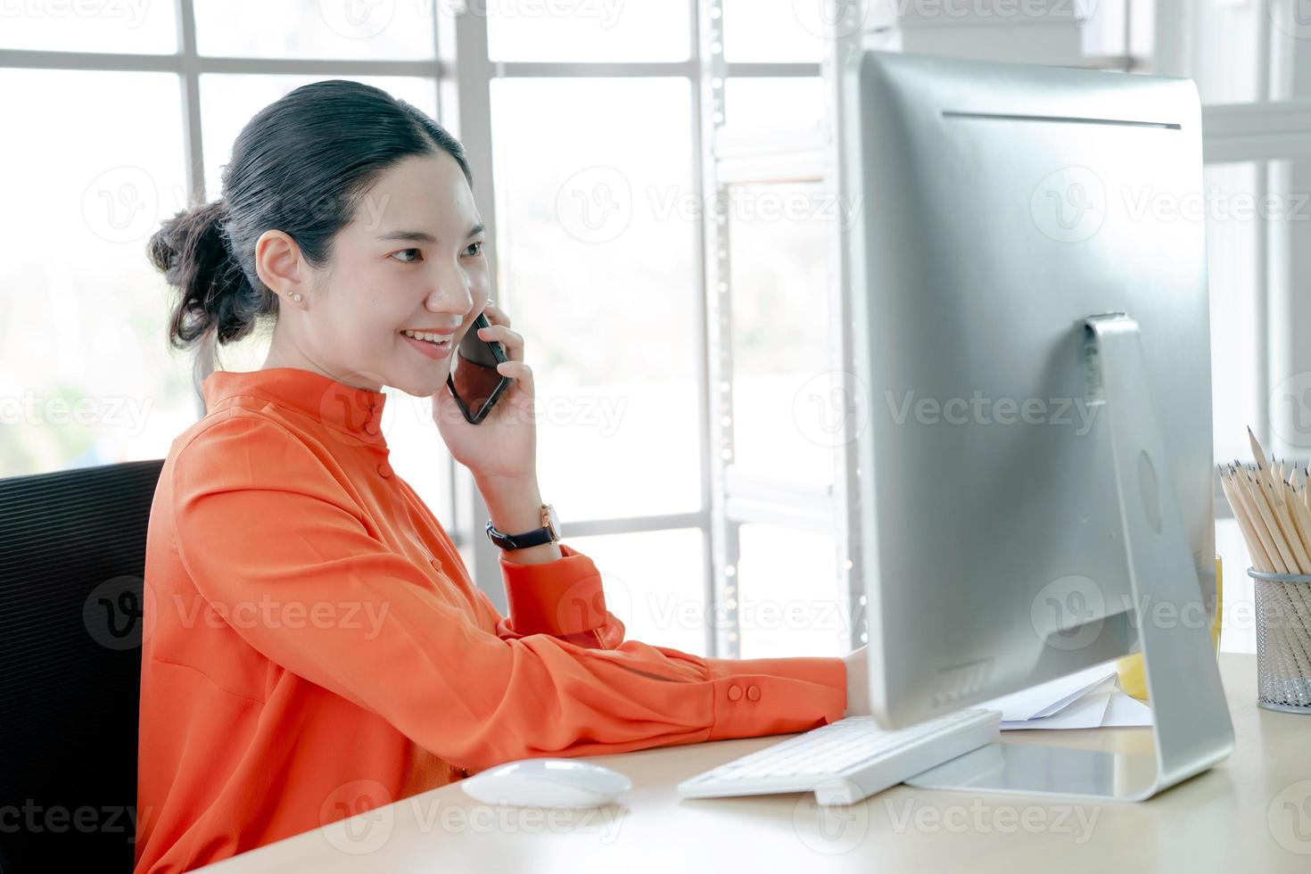 A Young Manager Asian businesswoman making Calls photo