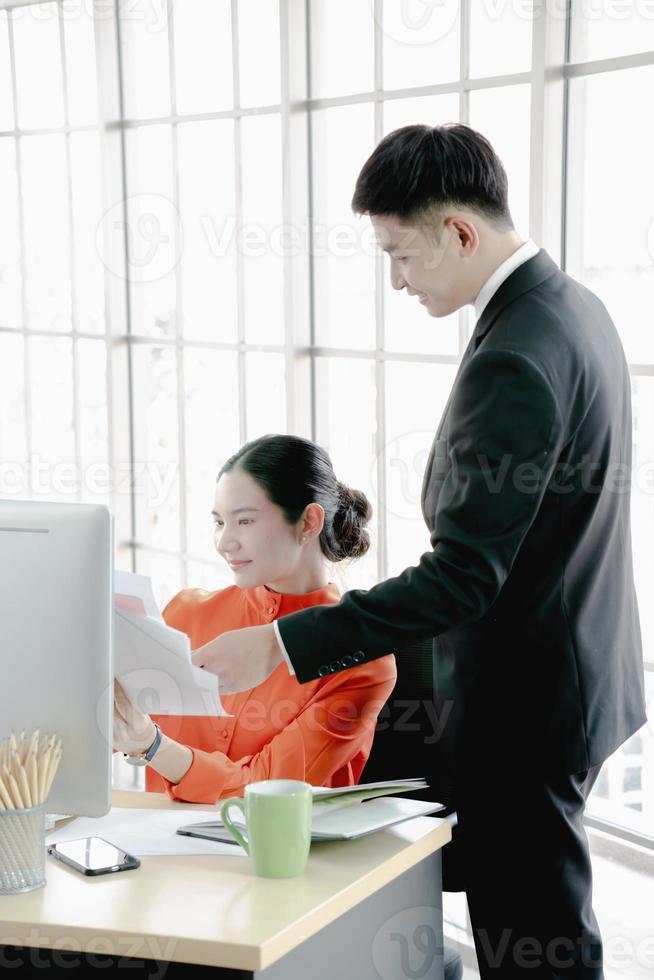 Helpful boss mentor explaining new online project to worker intern photo