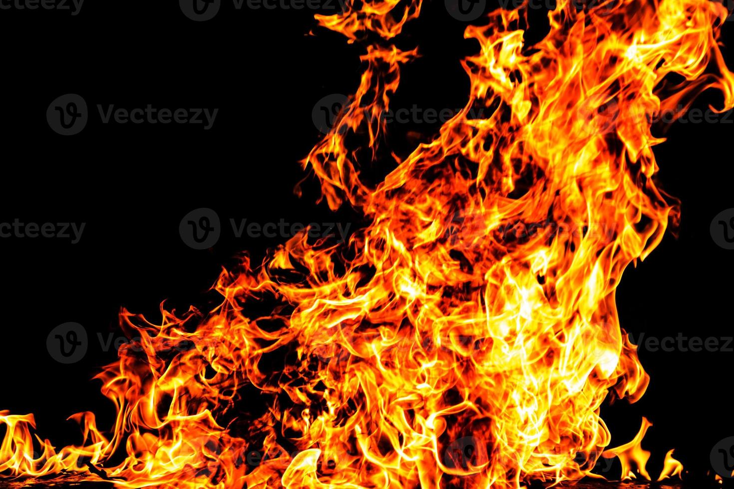 Fire flame texture. Burning material backdrop. Burn effect pattern. Blaze and torch wallpaper. Heat and haze backdrop. photo