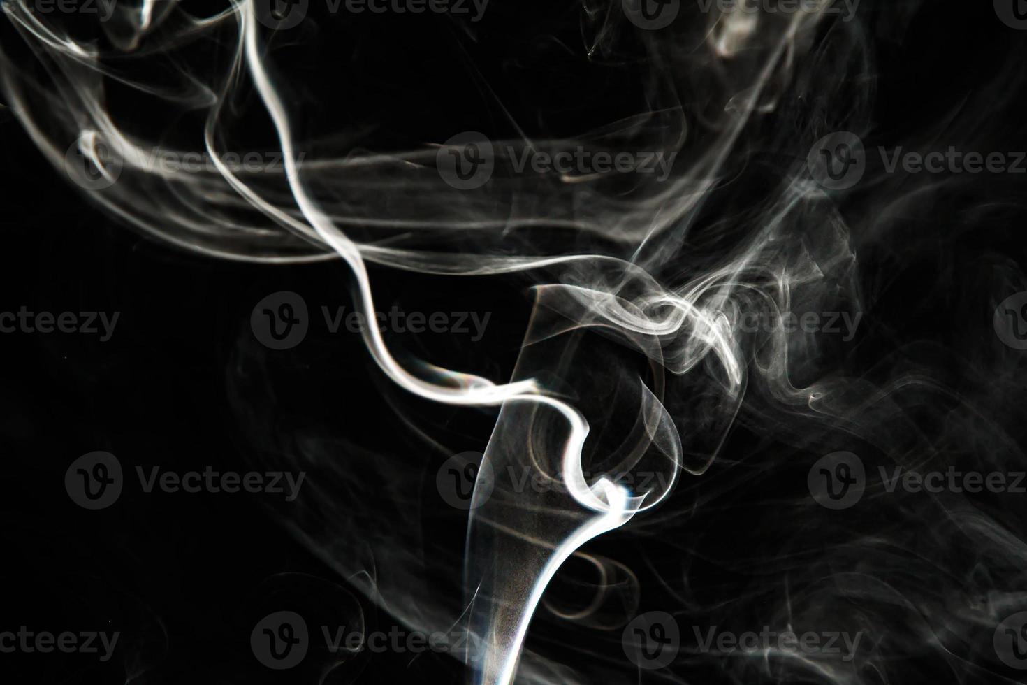 Smoke effect texture. Isolated background. Black and dark backdrop. Smokey fire and mistic effect. photo