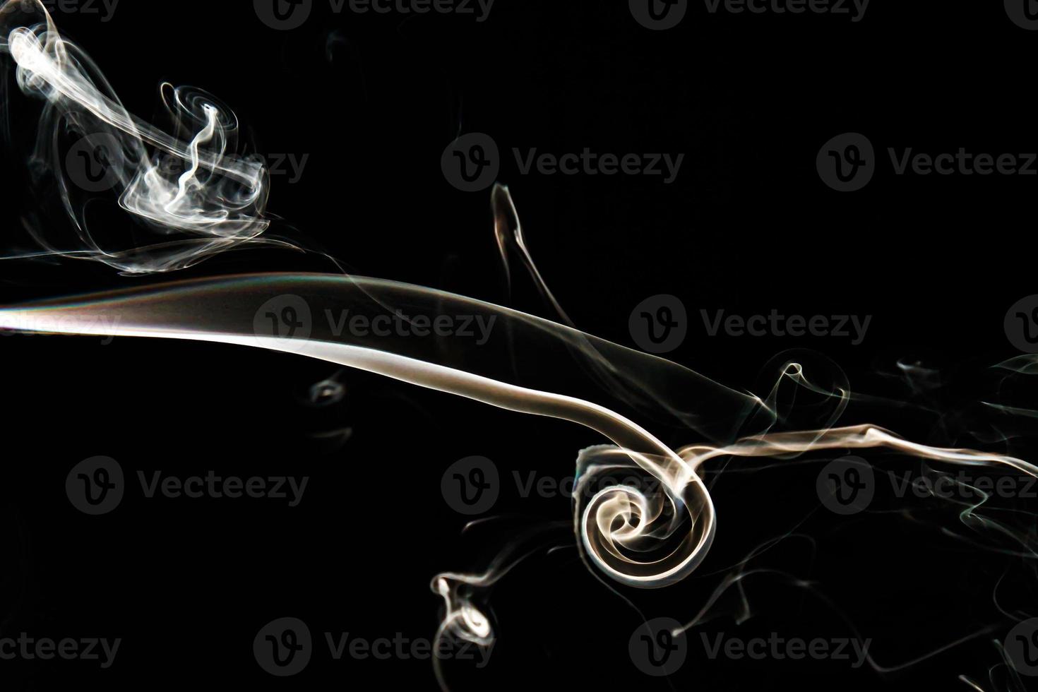 Smoke effect texture. Isolated background. Black and dark backdrop. Smokey fire and mistic effect. photo