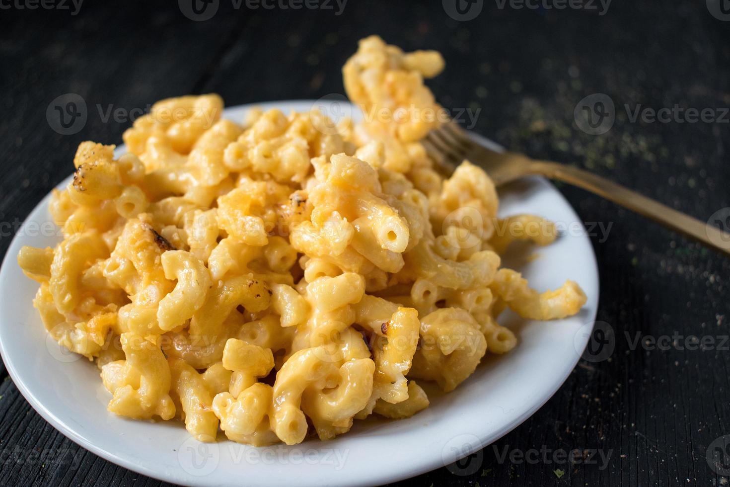 macaroni and cheese noodles in dish photo