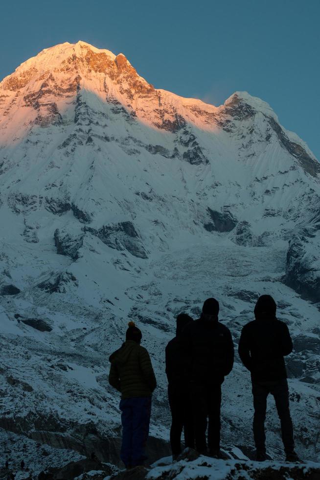 Annapurna south of himalaya mountain range in Nepal when the first sunrise shining to the peak. Annapurna South is one of the most impressive peaks of the Annapurna Range. photo