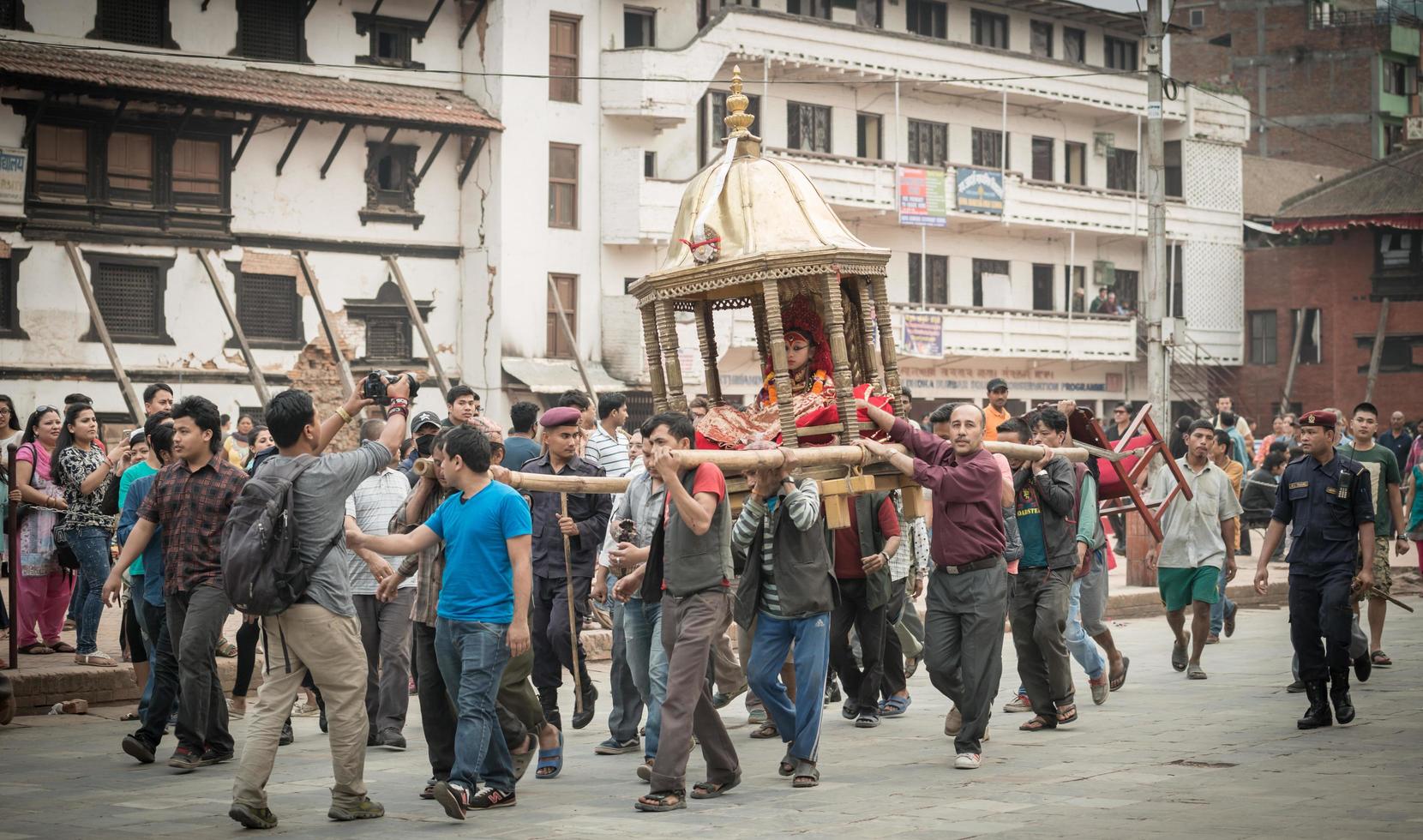 Kathmandu, Nepal - April 16 2016 - Nepalese people holding royal Kumari in the parade of Seto Machindranath Jatra festival in Kathmandu the capital cities of Nepal. photo