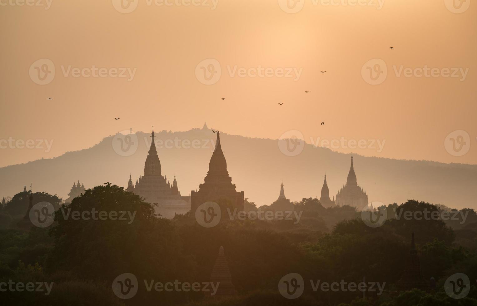 The silhouette of the ancient pagoda in Bagan one of UNESCO world heritage site and the first empire of Myanmar at sunset. photo