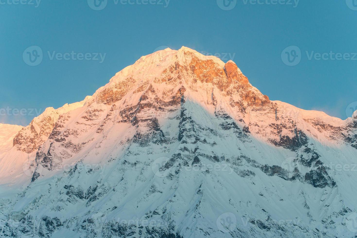 Annapurna south of himalaya mountains range in Nepal during the sunrise. Annapurna South is one of the most impressive peaks of the Annapurna Range. photo