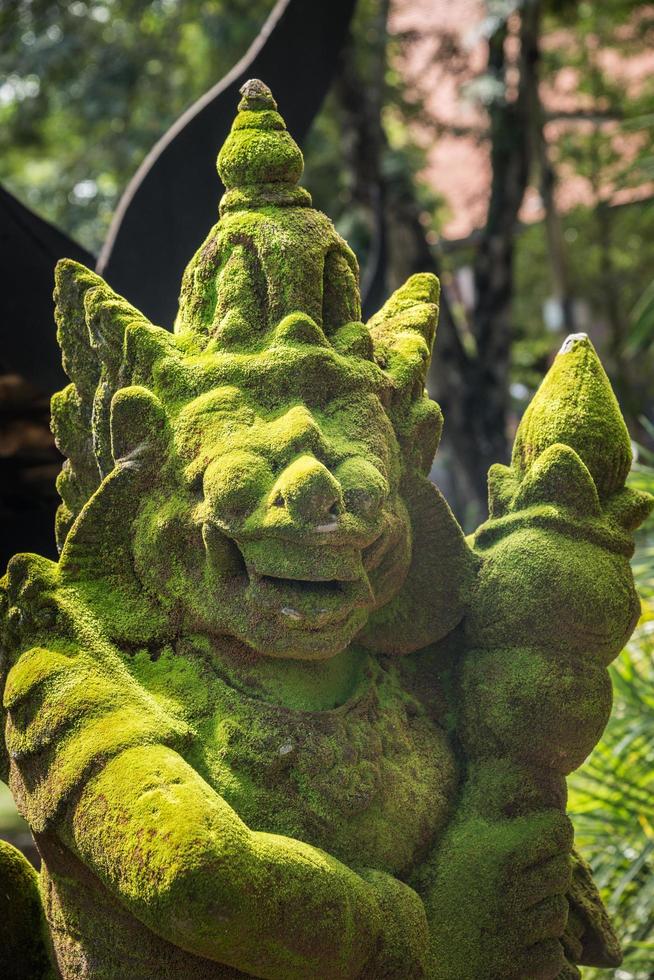 The rock giant statue in traditional Balinese style, popular decorative in many temple in Hindu religion of Bali, Indonesia. photo