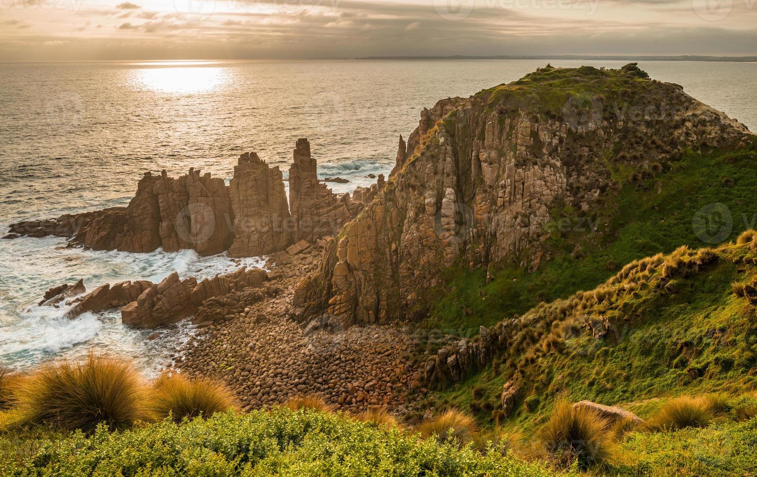 The Pinnacles rock an iconic tourist attraction of Cape Woolamai at Philip Island, Australia at sunset. photo