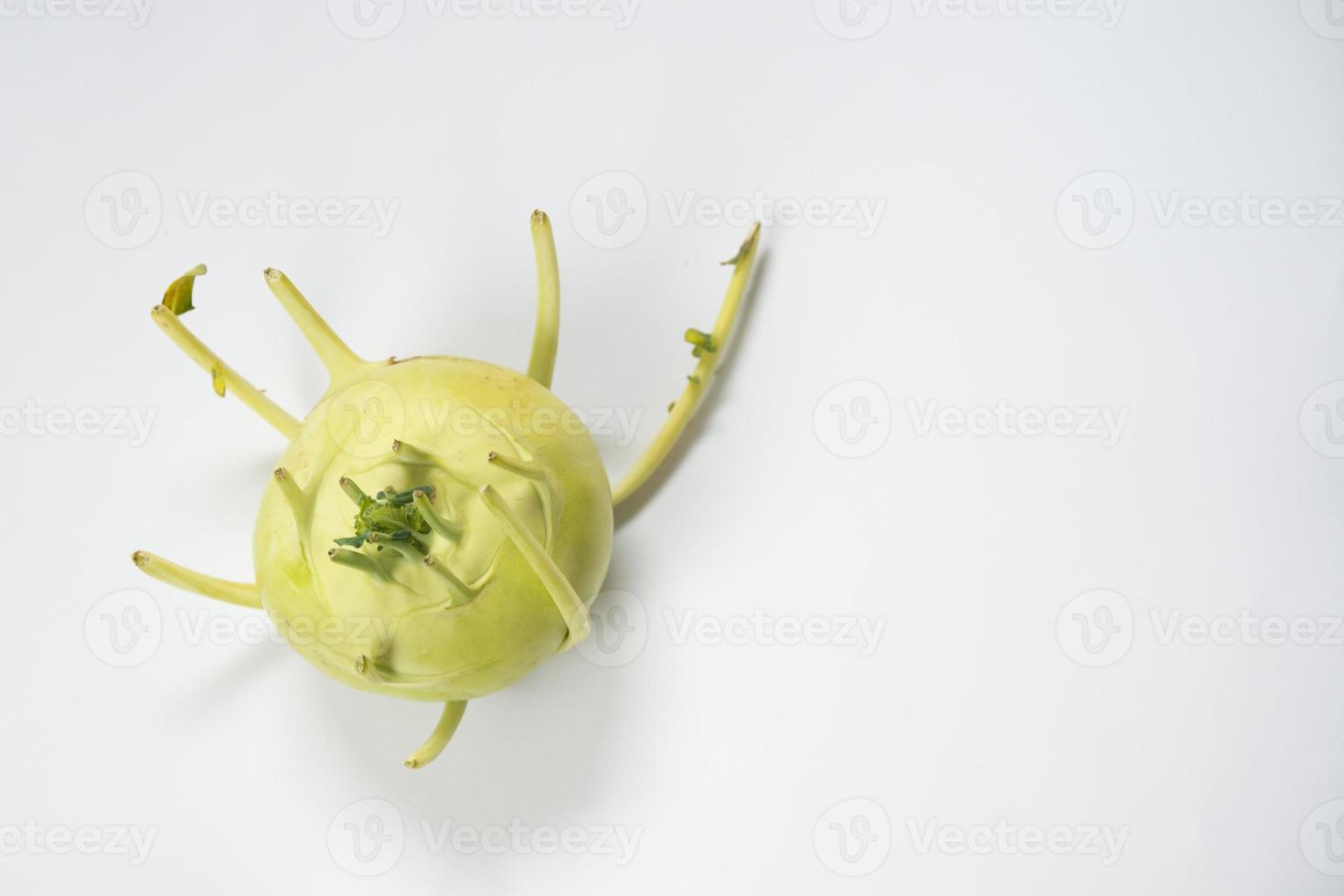 Kohlrabi with white background seen from above. photo