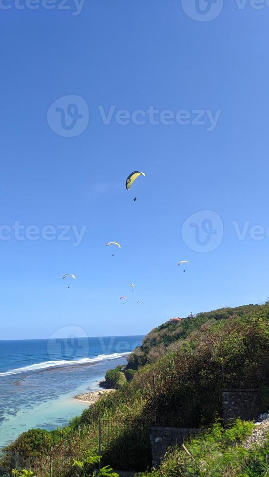 paragliding over the sea photo