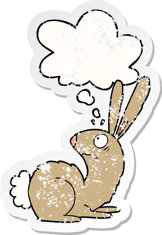 cartoon startled bunny rabbit and thought bubble as a distressed worn sticker vector