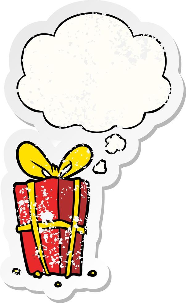 cartoon xmas present and thought bubble as a distressed worn sticker vector