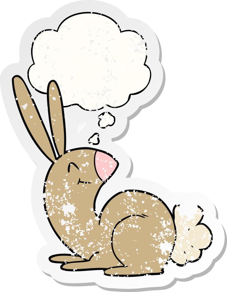 cute cartoon rabbit and thought bubble as a distressed worn sticker vector