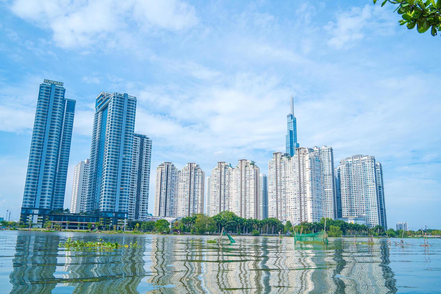 Ho Chi Minh city, VIETNAM - 12 FEB 2022 Beautiful blue sky view at Landmark 81 is a super tall skyscraper in center Ho Chi Minh City, Vietnam and Saigon bridge with development buildings photo