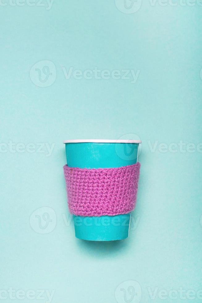 Mockup of coffee paper cup on a green background. photo