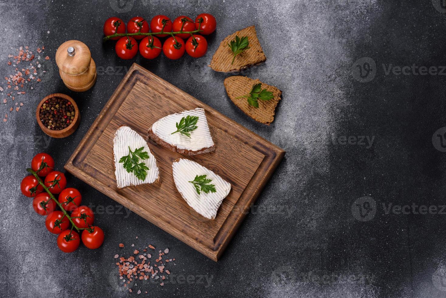 Sliced bread with cream cheese and butter for breakfast photo