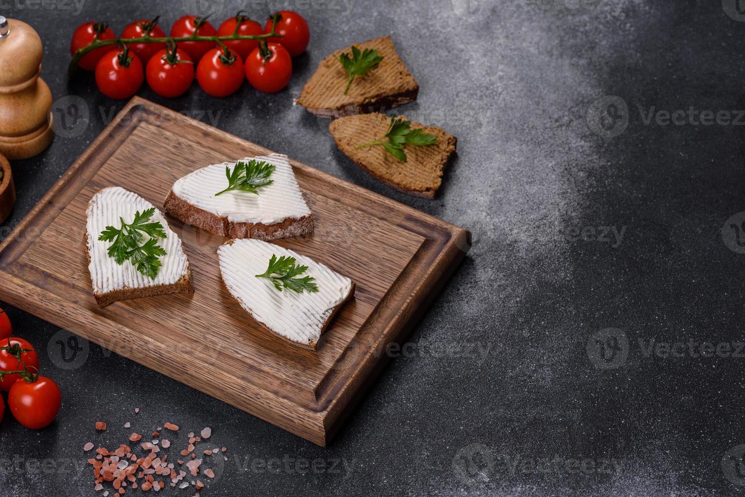 Sliced bread with cream cheese and butter for breakfast photo