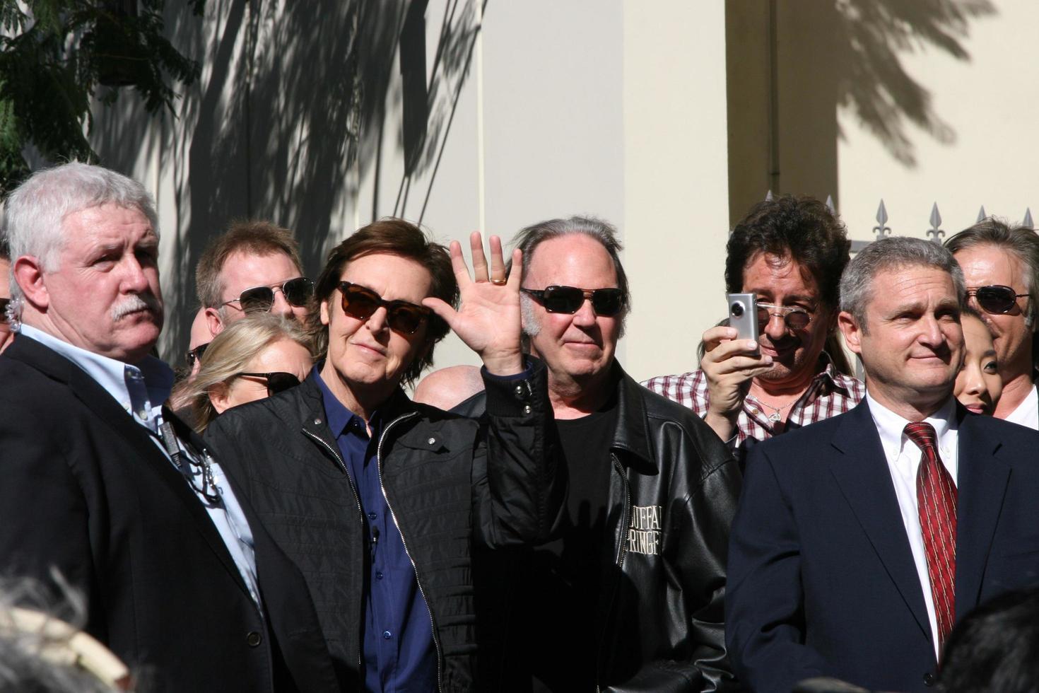 LOS ANGELES, FEB 9 - Paul McCartney, Neil Young at the Hollywood Walk of Fame Ceremony for Paul McCartney at Capital Records Building on February 9, 2012 in Los Angeles, CA photo