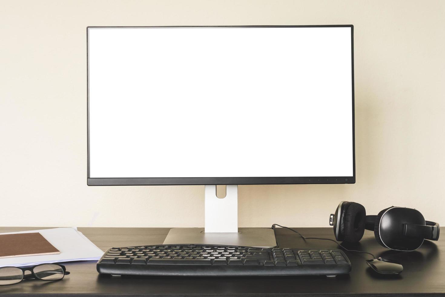 Computer with white screen on the desk. photo