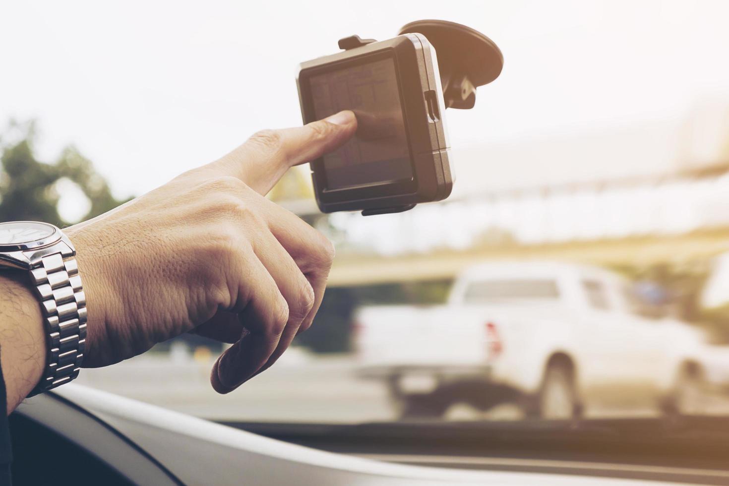 Man driving car using navigator photo