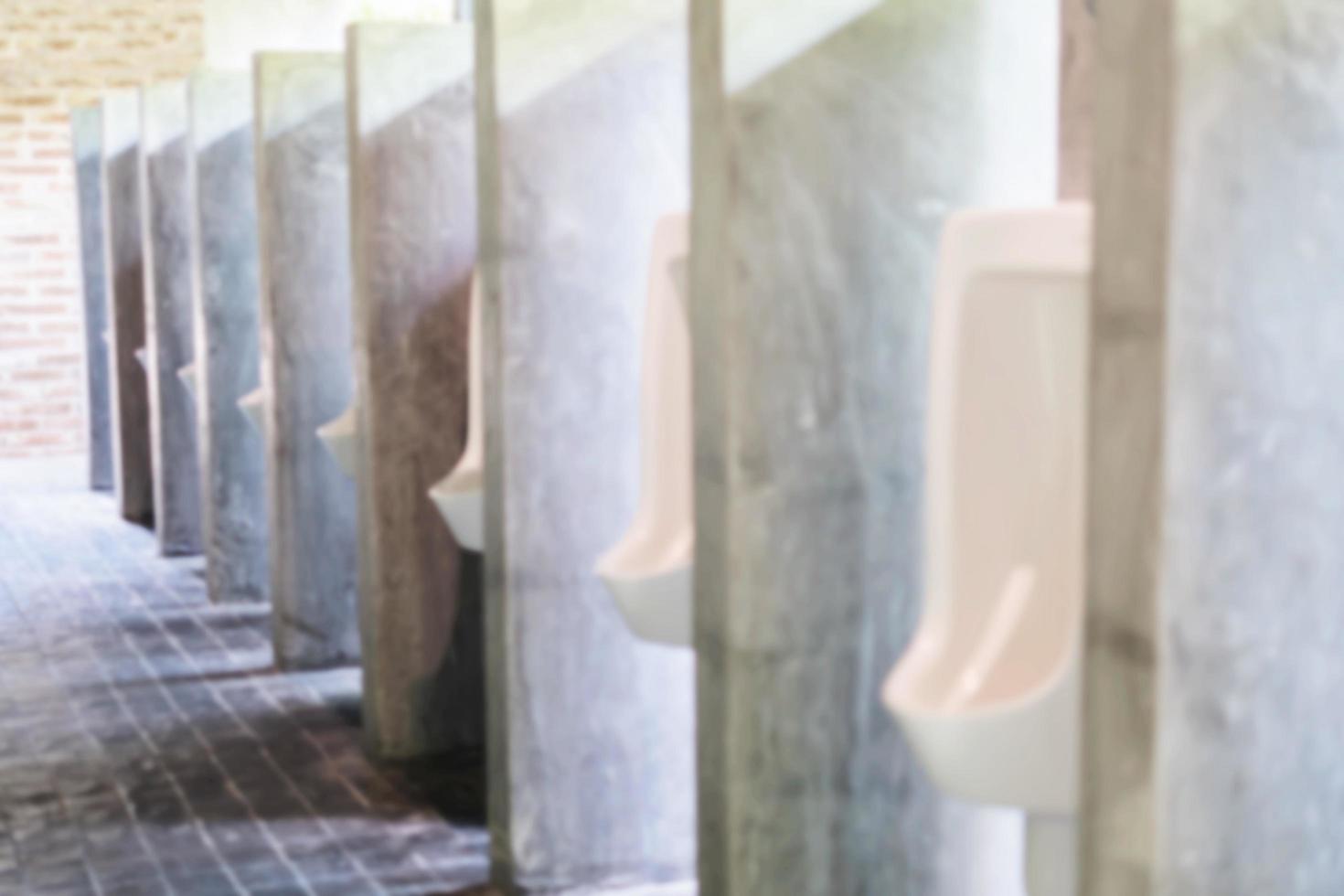 soft focus of urinal row in man toilet - urine healthcare background concept photo