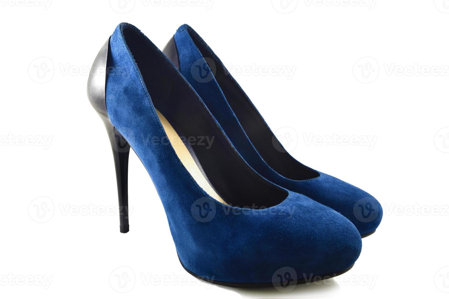 Blue suede shoes on a white background. photo