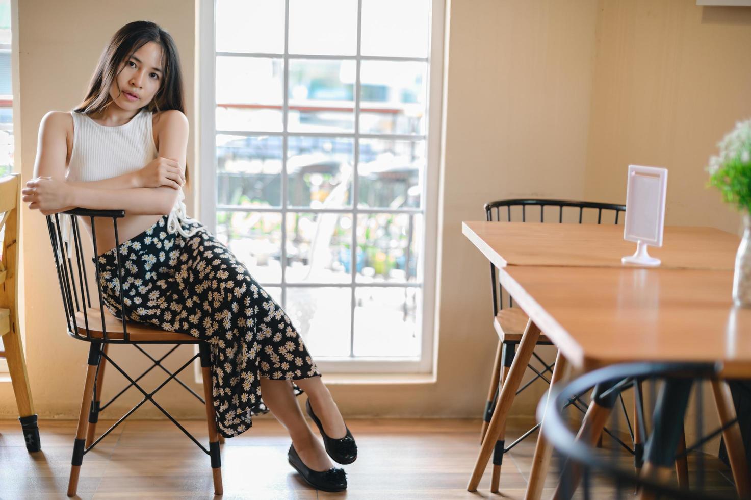 PORTRAIT Pretty woman in a restaurant, cafe with feeling happy photo