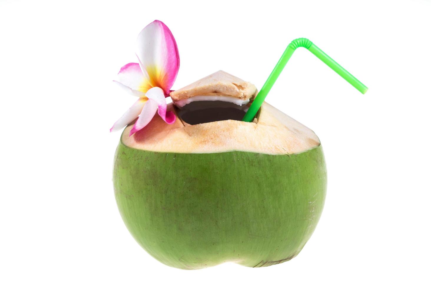 Green coconuts with drinking straw on white background photo