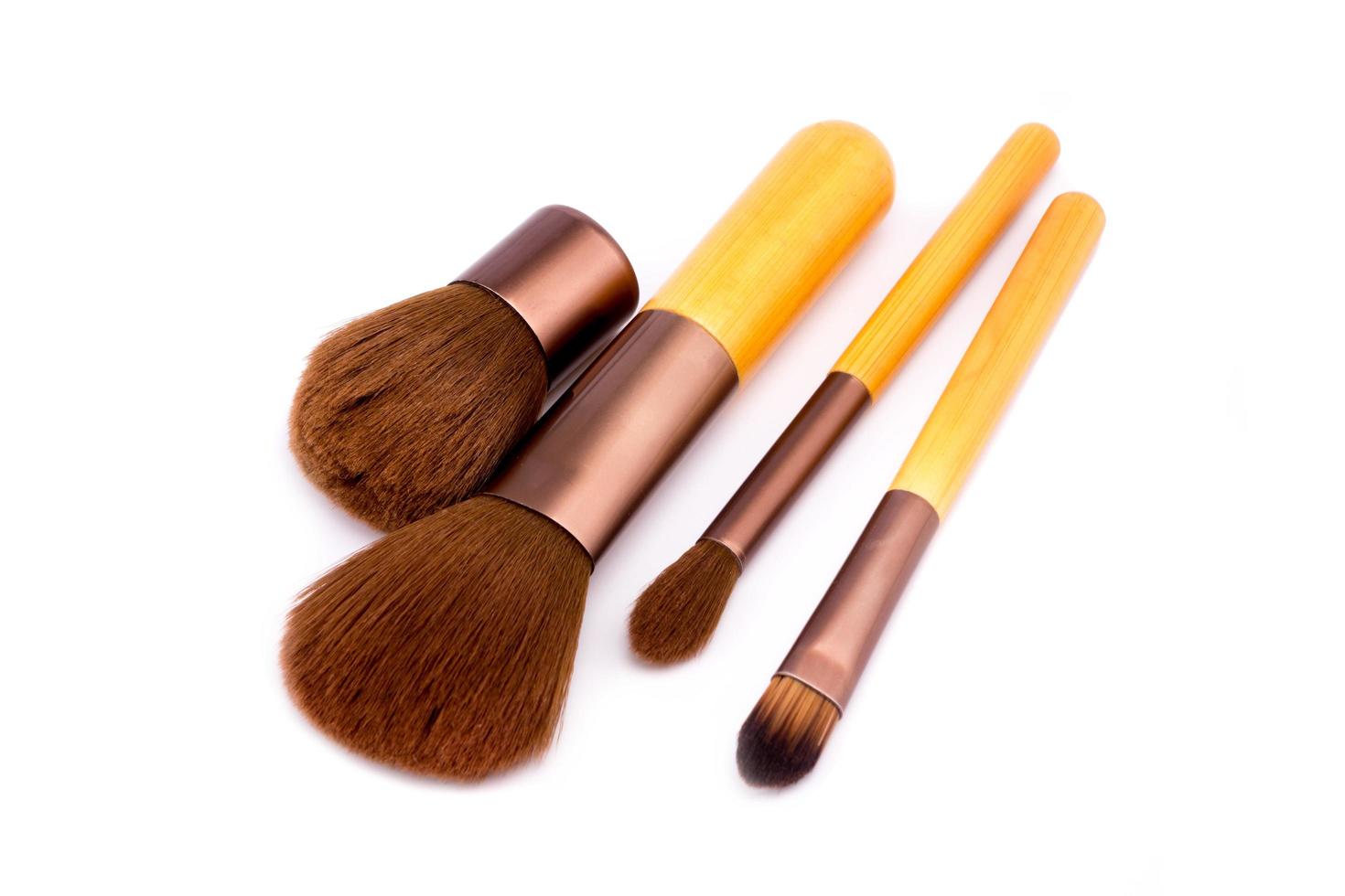 Set of makeup brushes on white background photo