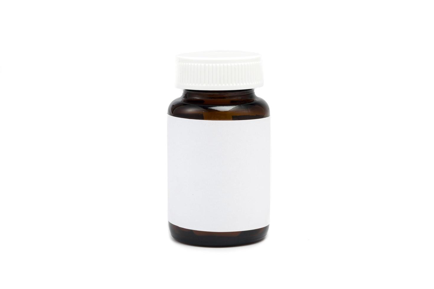 Blank plastic medicine bottle isolated on white photo