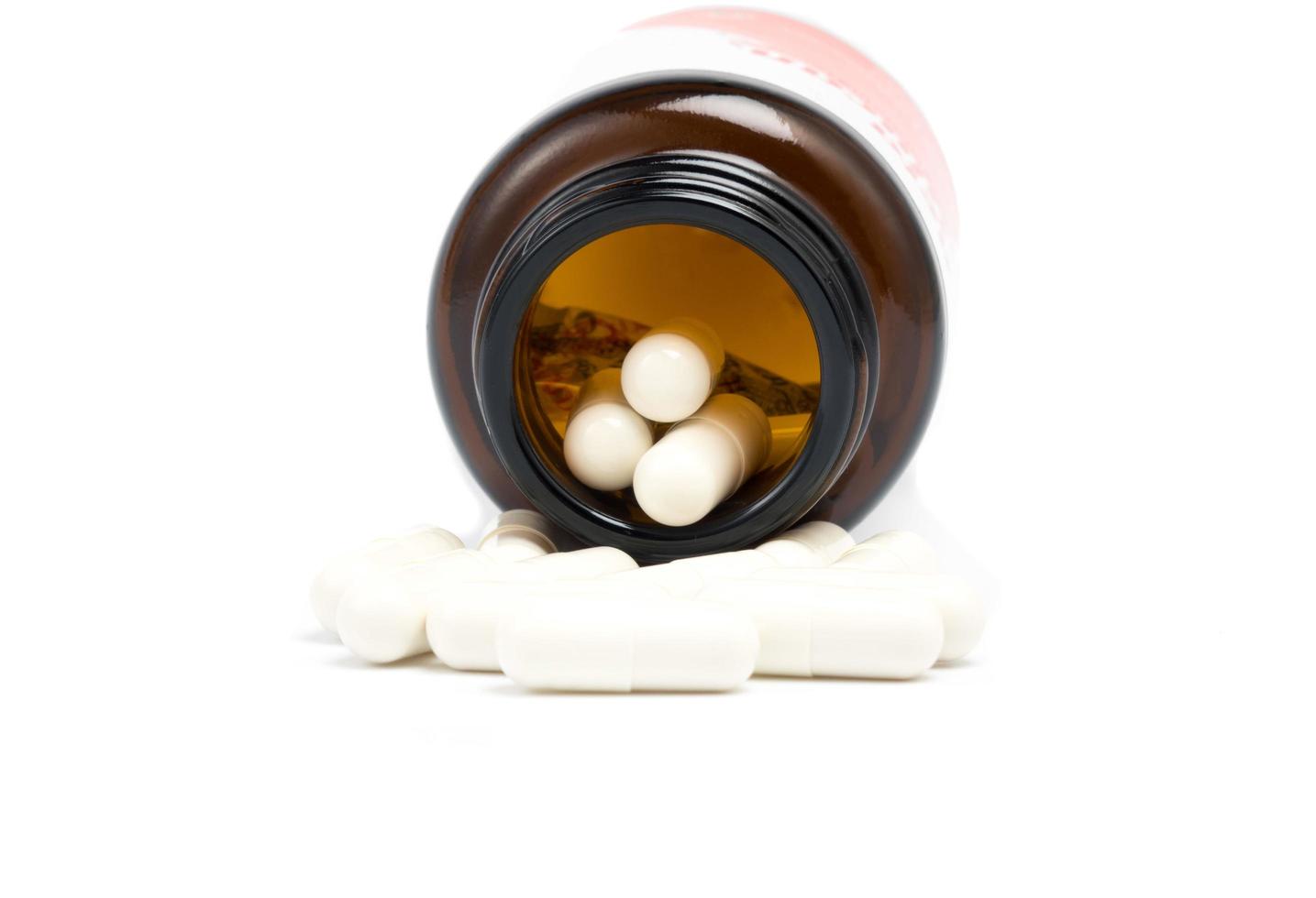 white pills with Bottle on white photo