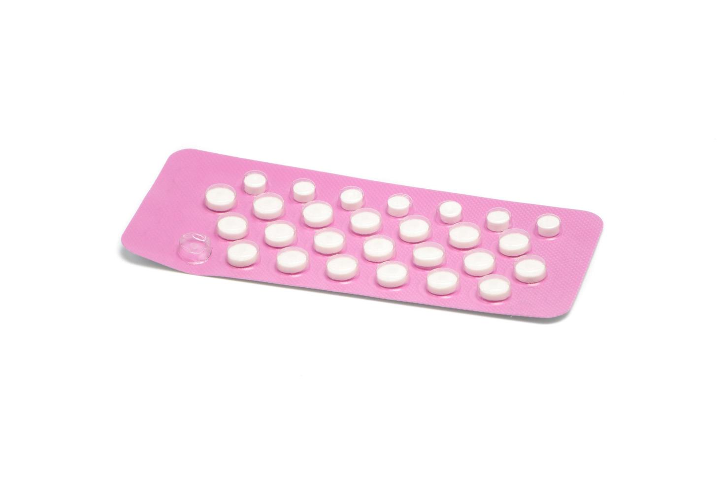 Birth Control Pills on white background photo