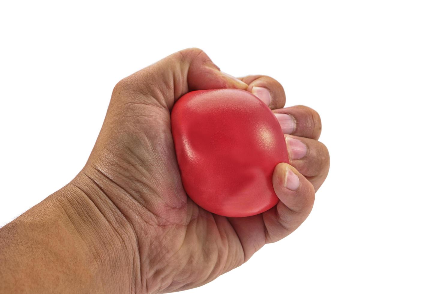 Hand squeezing a stress ball photo