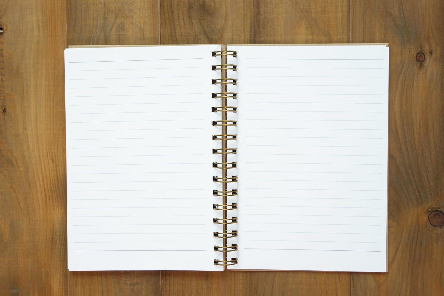 blank notebook on wooden table, business concept photo
