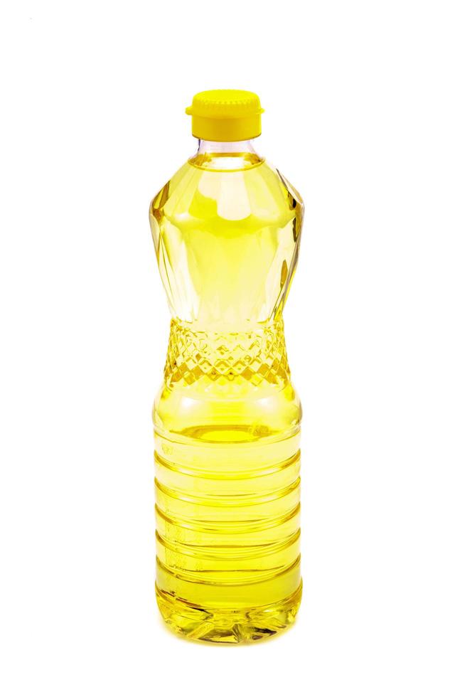 Bottle of vegetable oil for cooking isolated on white background photo