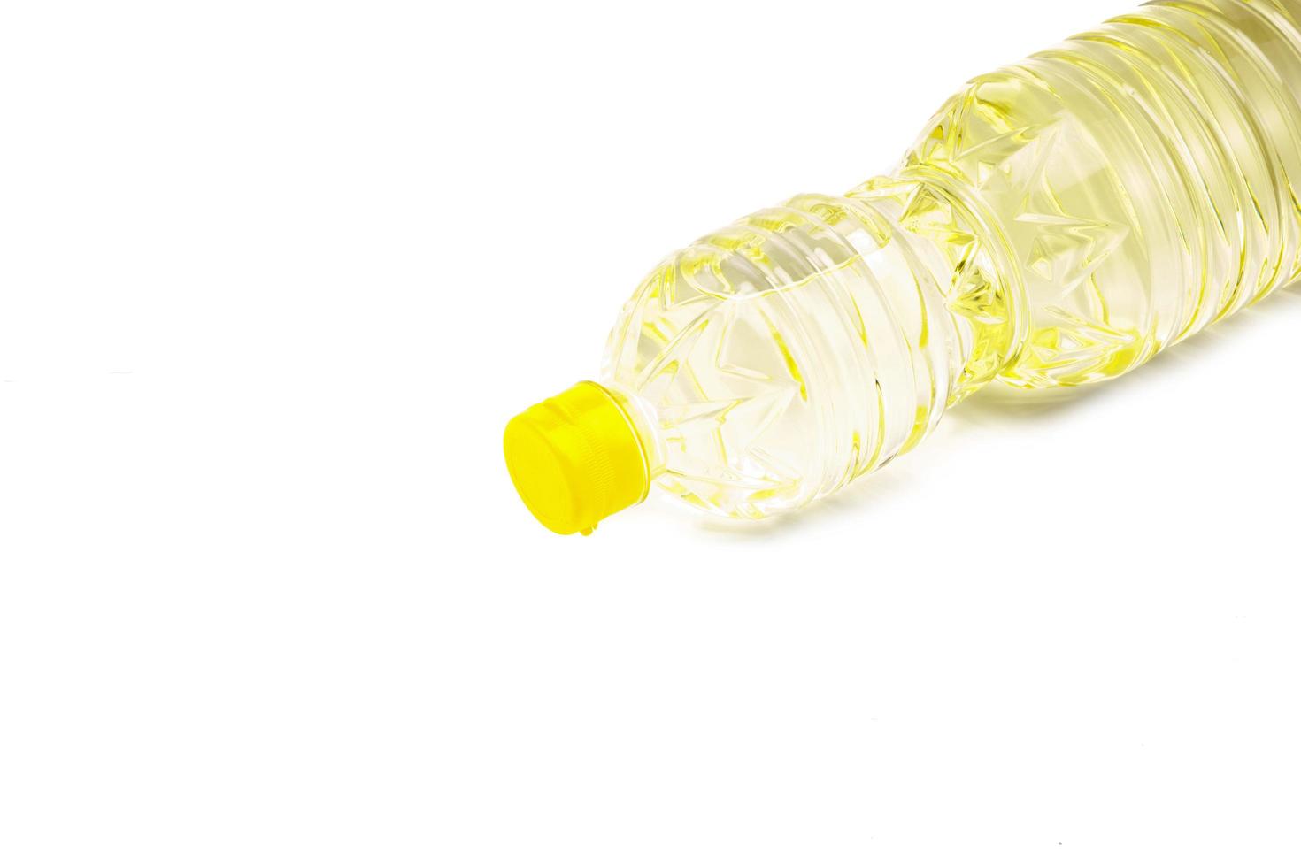 Bottle of vegetable oil for cooking isolated on white background photo