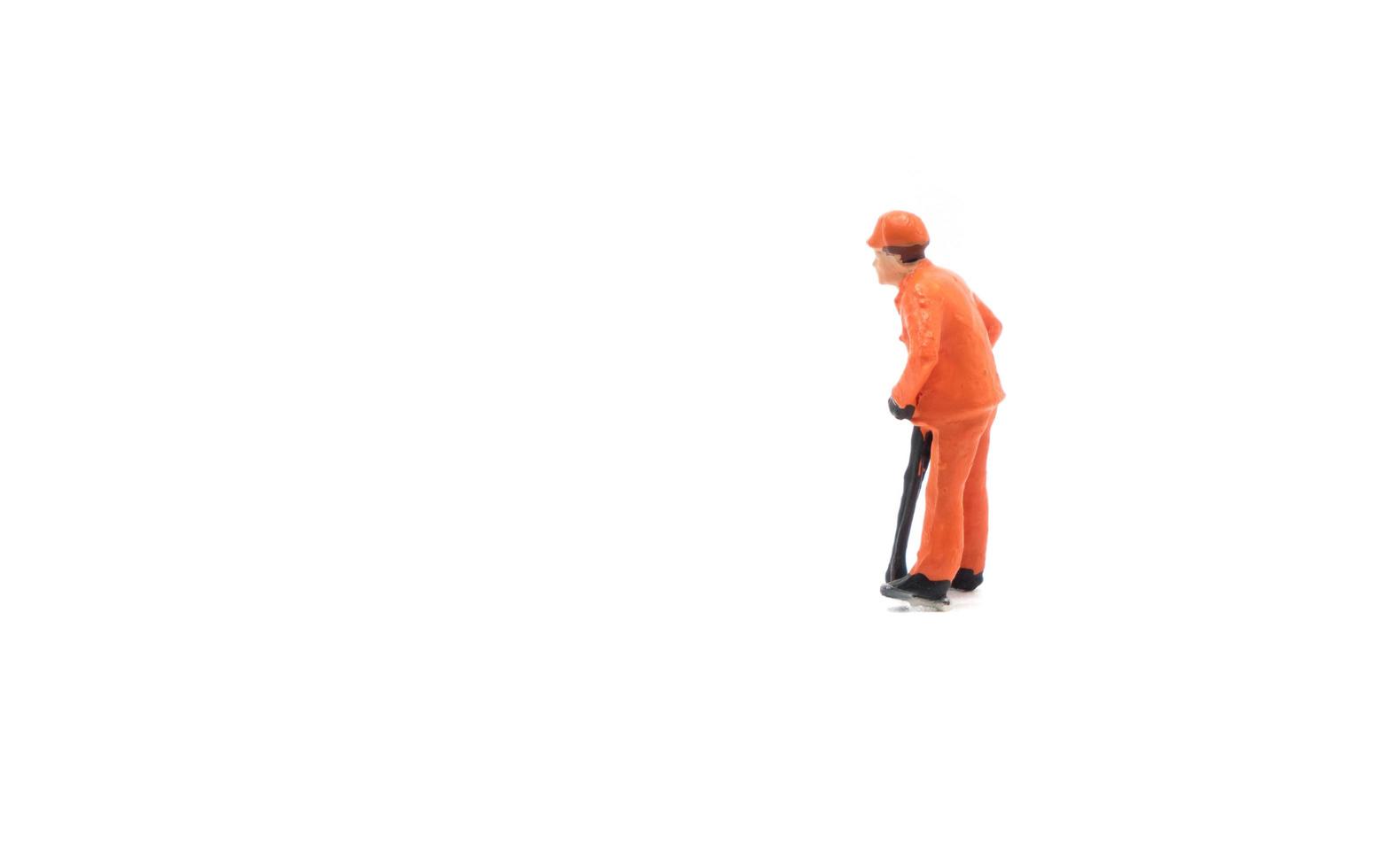 Miniature people engineer worker construction concept isolated on white background photo