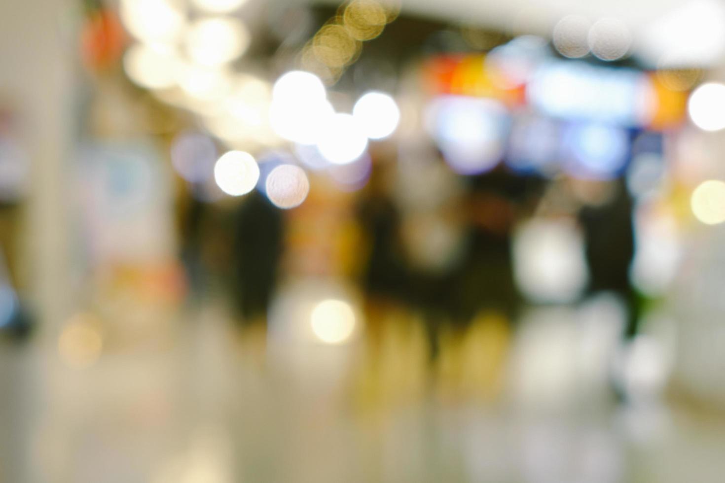 Abstract blur and bokeh shopping mall and department store interior for background photo