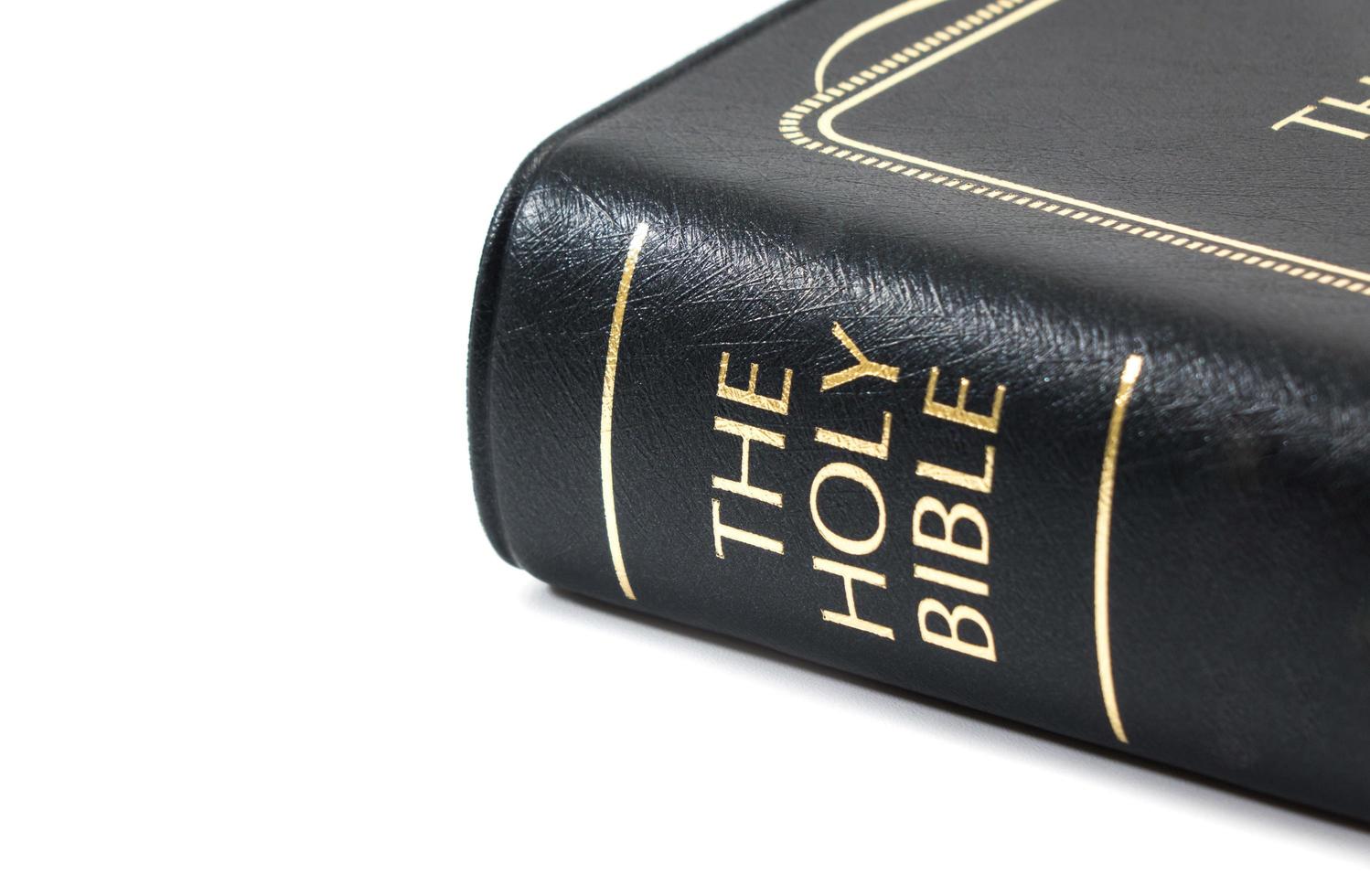 Holy Bible on white background photo