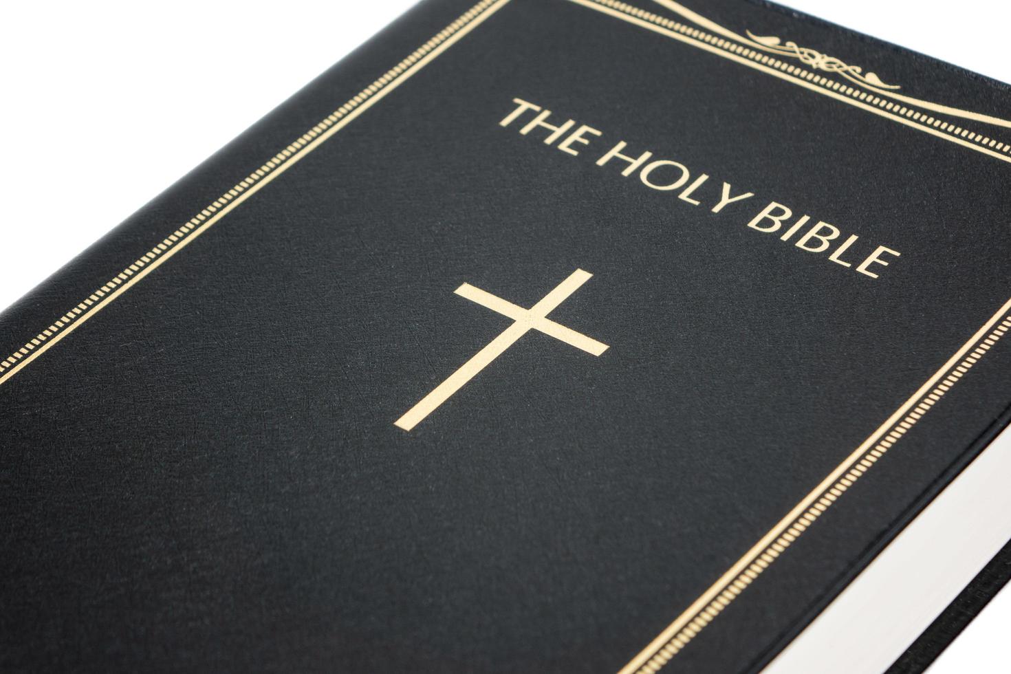 Holy Bible on white background photo