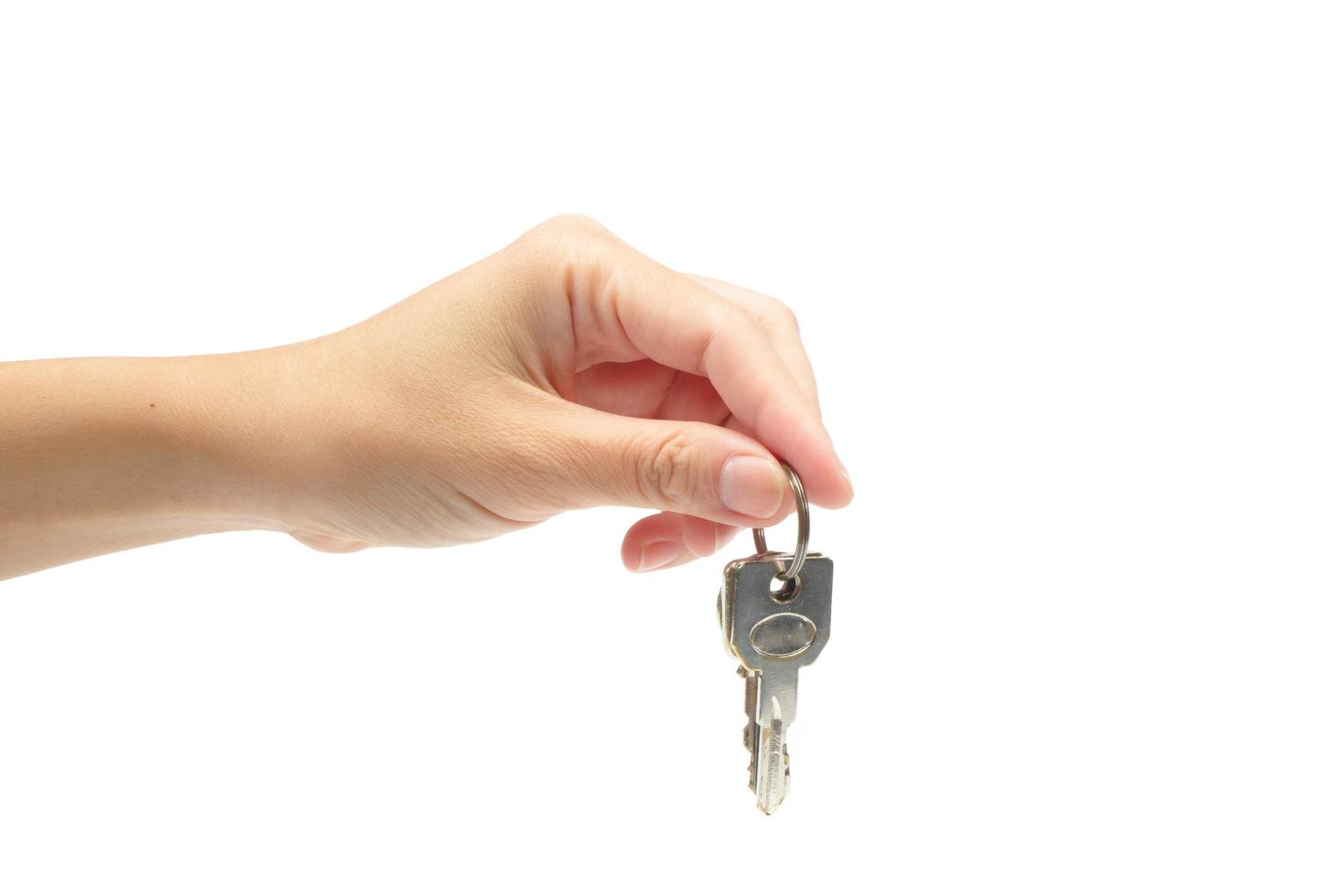 woman's hand holding a key photo