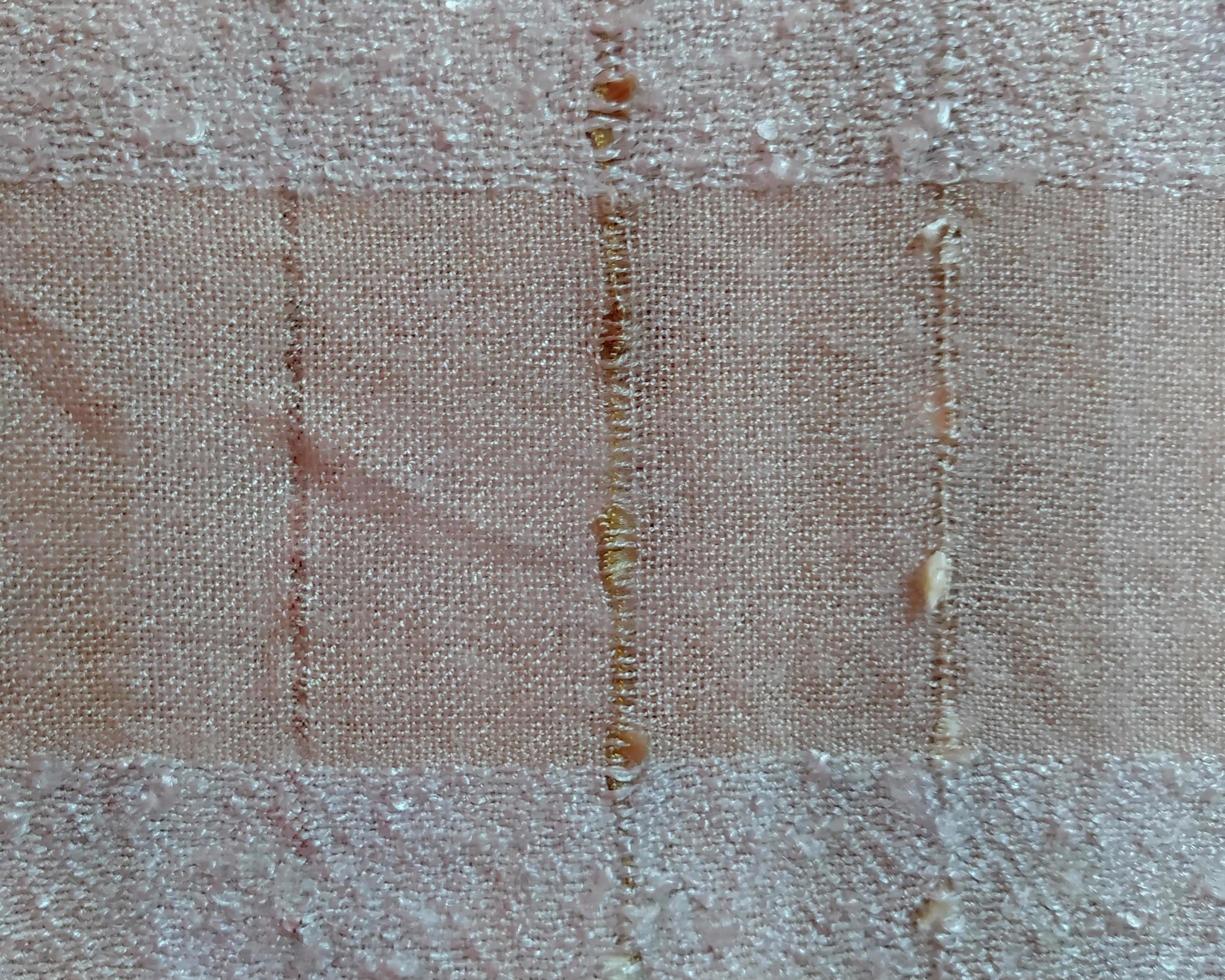 Macro of the light orange fibers of the scarf. photo