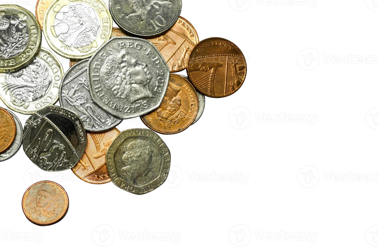 Top view and crop of British currency coins isolate on white background. photo